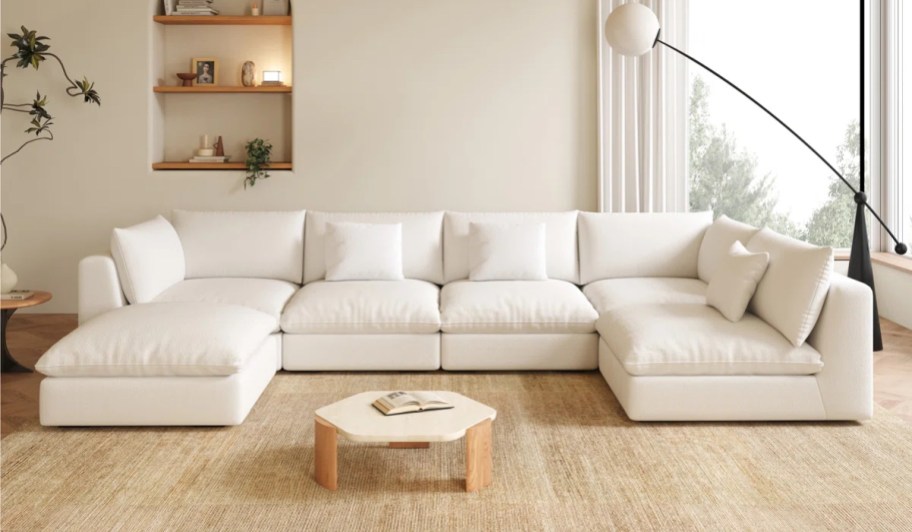 white sectional sofa in neutral living room