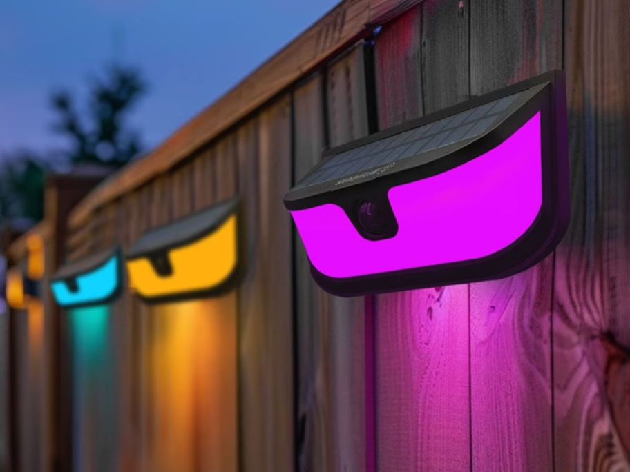Westinghouse 1200-Lumen Solar LED Motion Activated Color Changing Wall Lights on fence