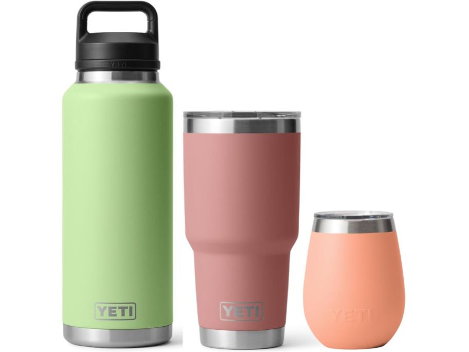 3 YETI water bottles in green, pink, and peach