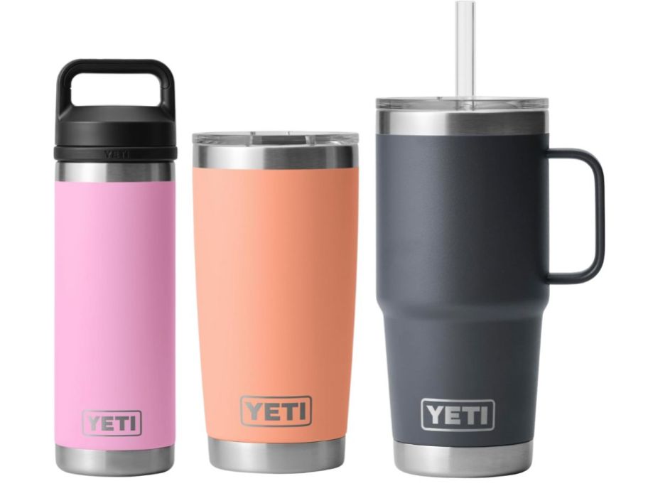 3 YETI water bottles in pink, peach, and gray