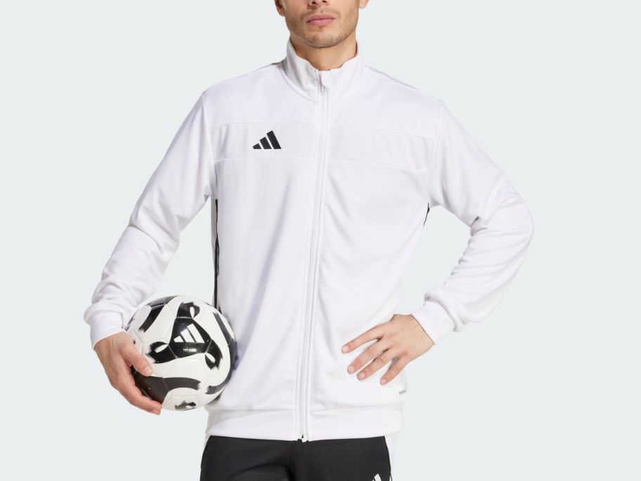 A man wearing a white jacket