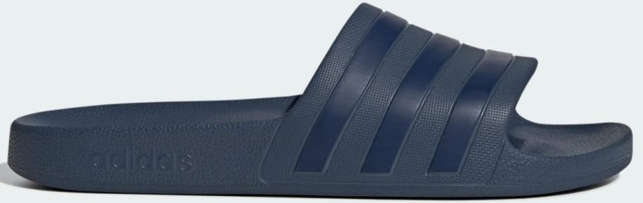 a navy blue slide shoe