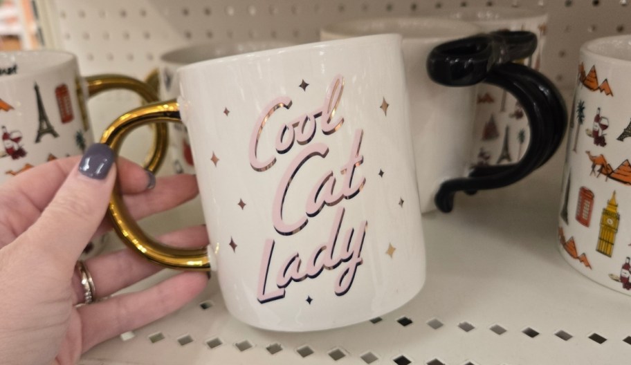 woman hand holding a coffee mug