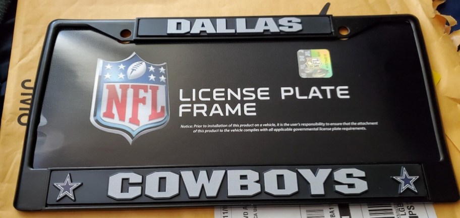 dallas cowboys license plate cover on table