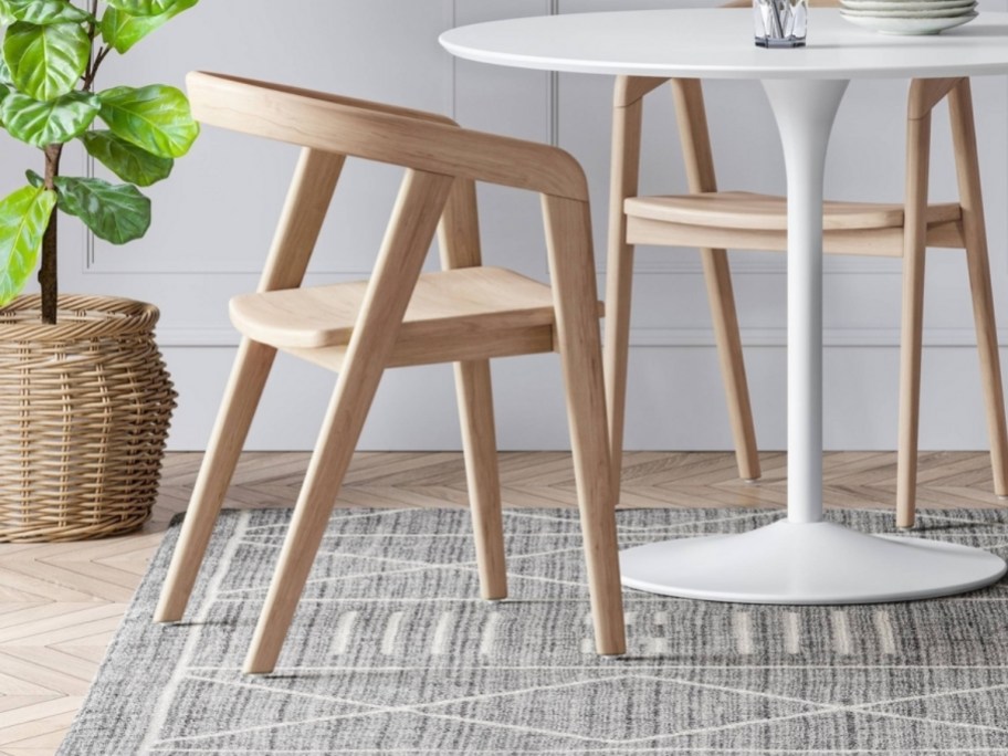 a natural colored wooden dining chair