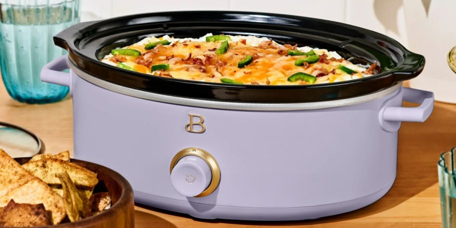 purple slow cooker on table