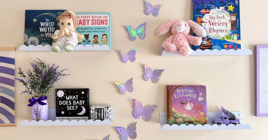 white floating shelves on wall with books on them