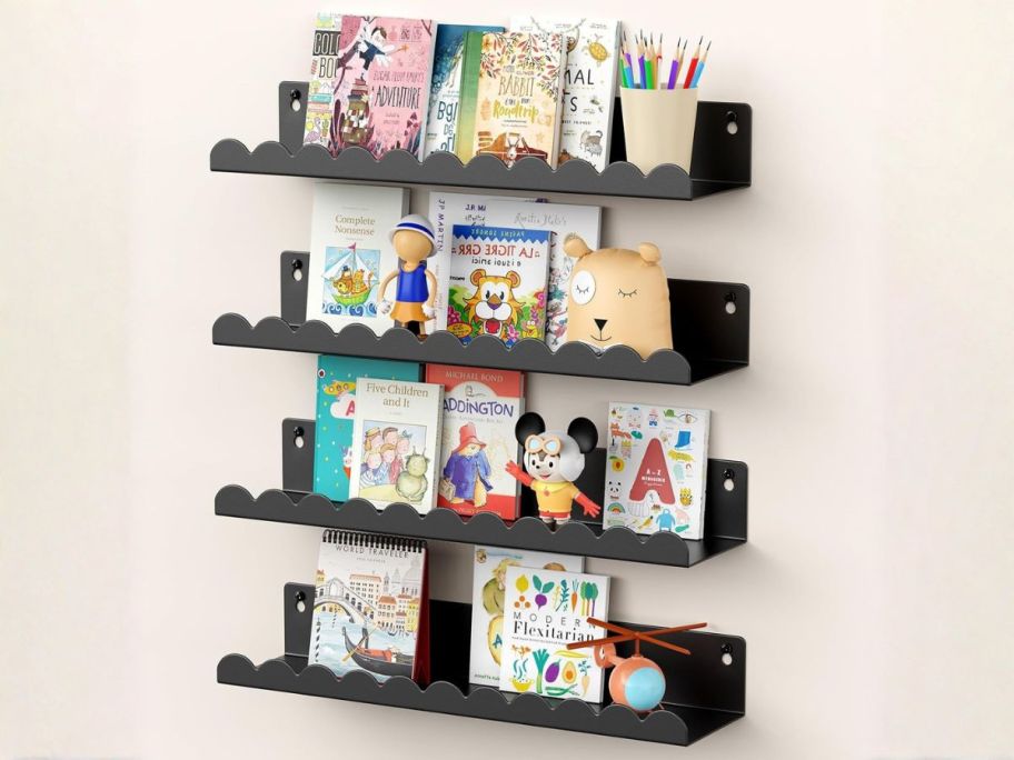 black floating shelves on wall with books on them