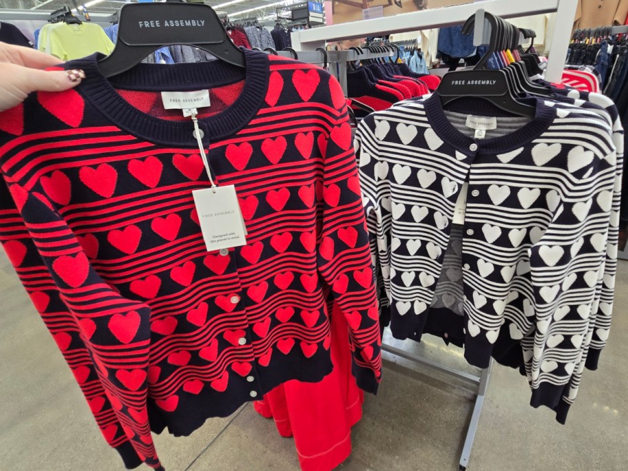 Two Free Assembly sweaters on a rack at Walmart.
