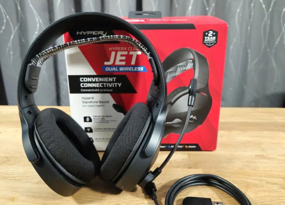 gaming headphones sitting on table with box