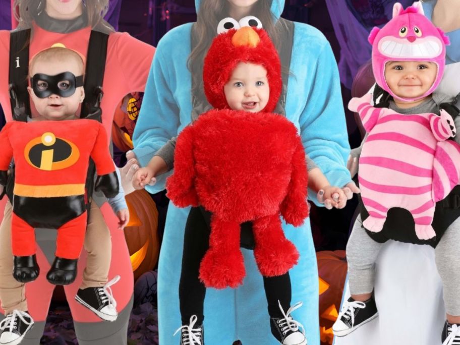 3 adults with costumes on holding matching baby carrier