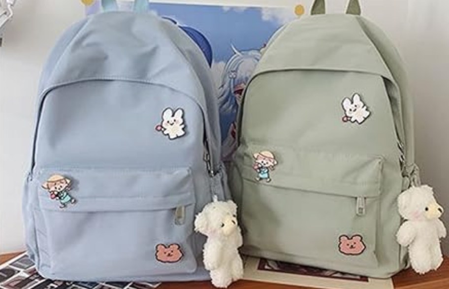 a pastel blue and green laptop backpacks on a tabletop