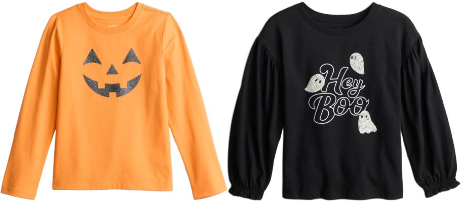 Two Jumping Beans long-sleeve kids' Halloween t-shirts shown side by side, featuring an orange shirt with a black glitter jack-o'-lantern face on the left and a black shirt with white ghosts and the text "Hey Boo" on the right.