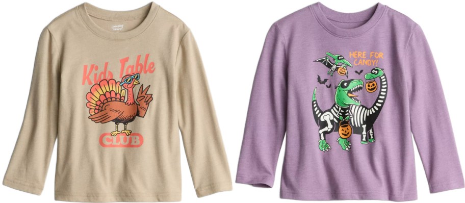 Two Jumping Beans long-sleeve kids' t-shirts shown side by side, featuring a tan Thanksgiving shirt with a turkey graphic and the text "Kid's Table CLUB" on the left and a purple Halloween shirt with skeleton dinosaurs and the text "HERE FOR CANDY!" on the right.