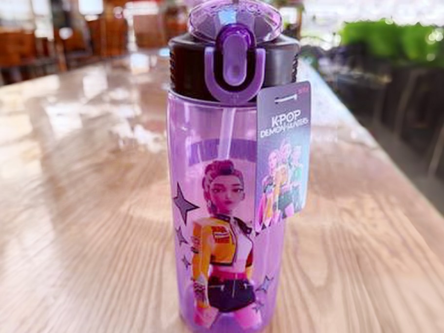 purple demon hunters bottle on table