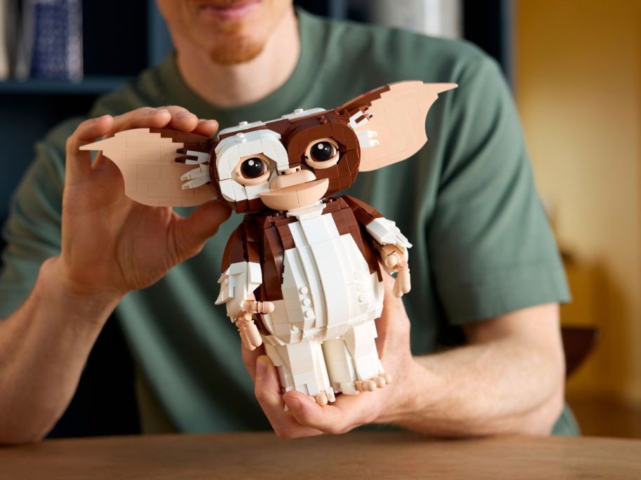 hands holding gremlins gizmo lego
