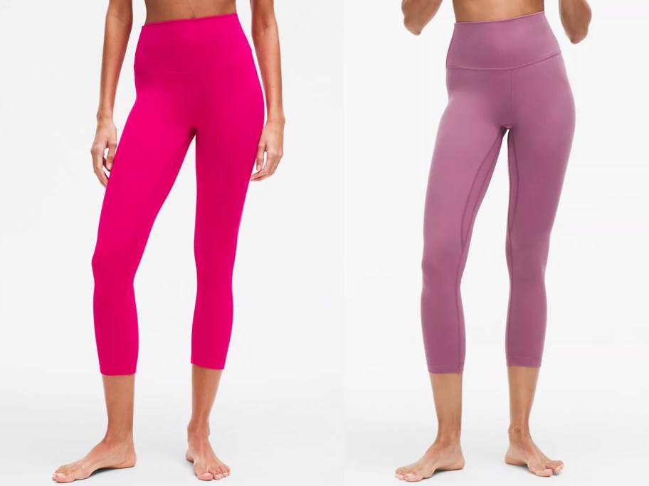 two women in pink and purple leggings