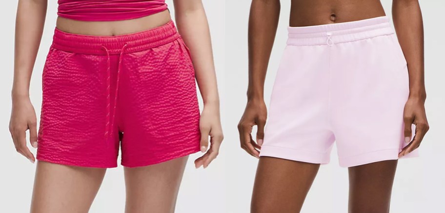 two women in dark and light pink shorts