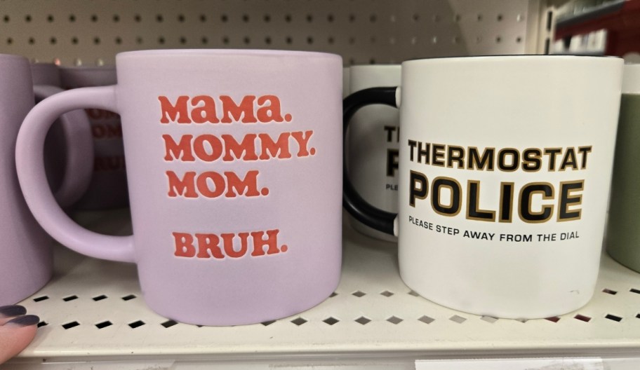 two coffee mugs on a store shelf