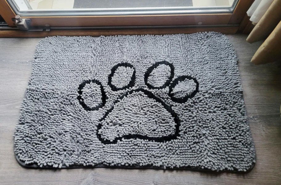 gray door mat with dog paw print image