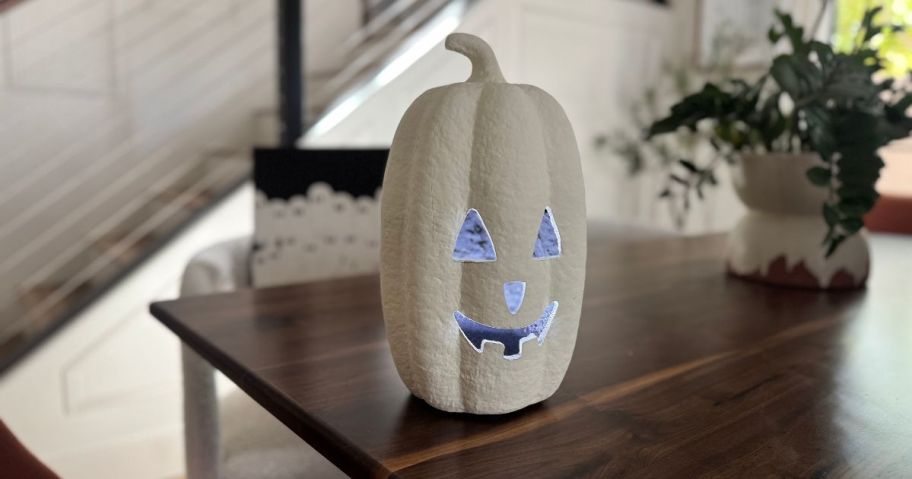 white Paper Mache Jack-o'Lantern on table