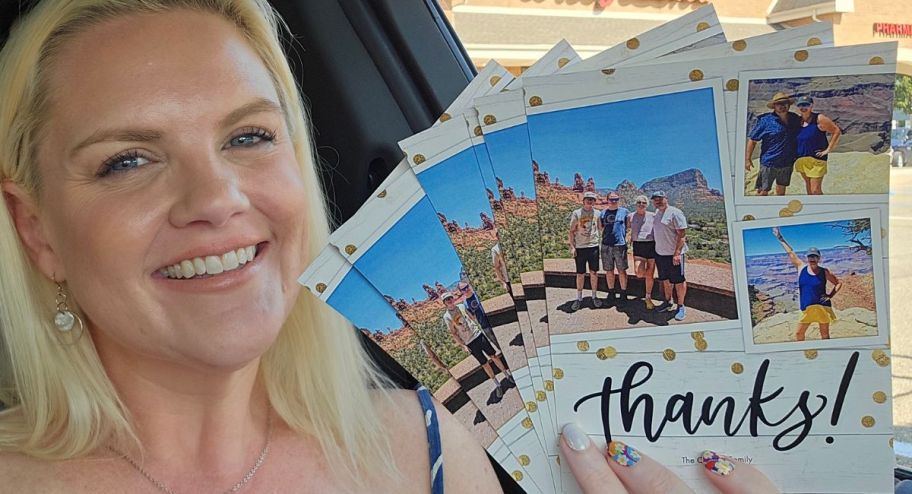 Woman holding 6 photo cards in hand