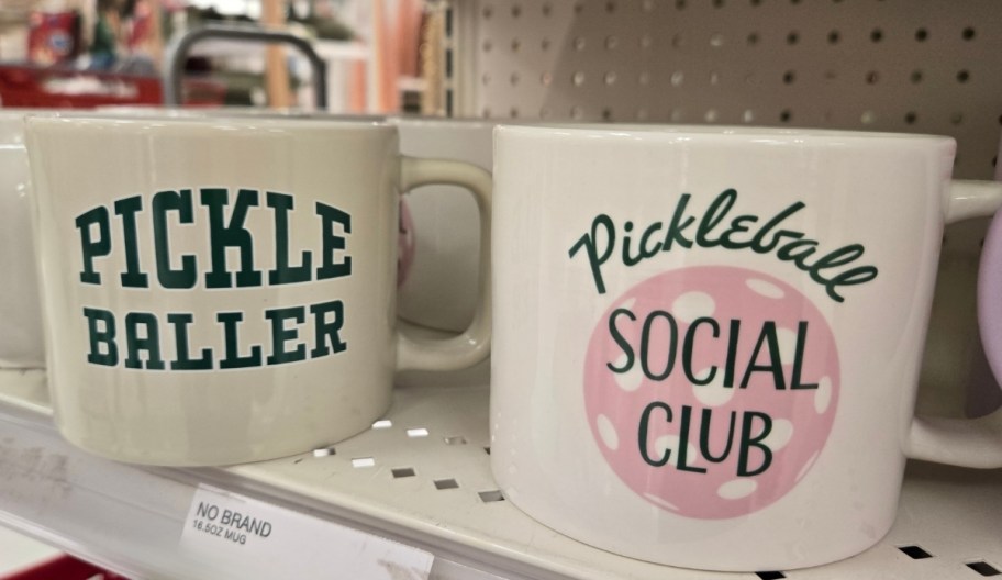 two coffee mugs on a store shelf