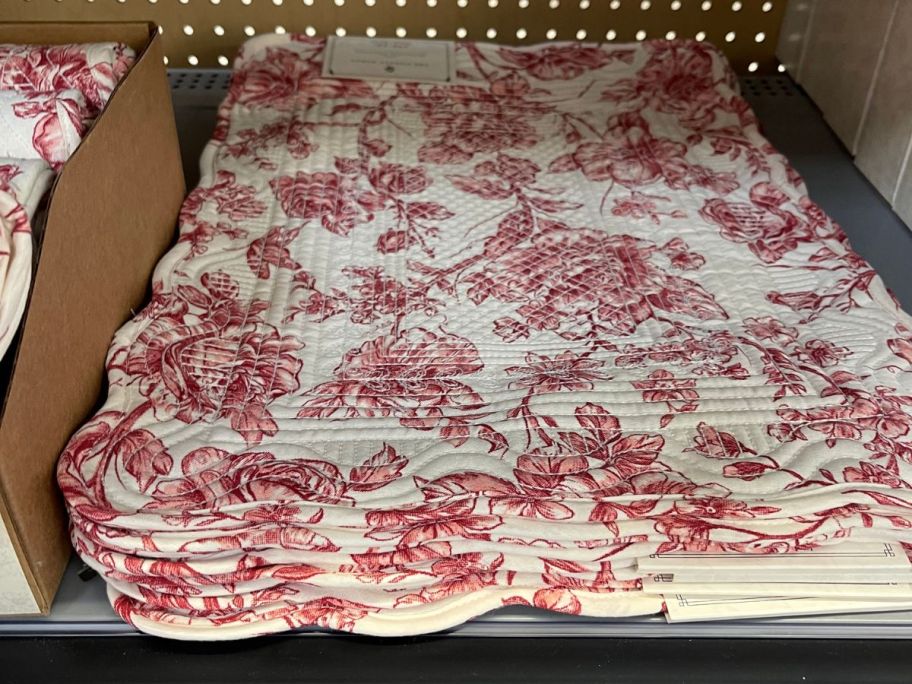 The Pioneer Woman Agatha Quilted Fabric Placemats on shelf in store