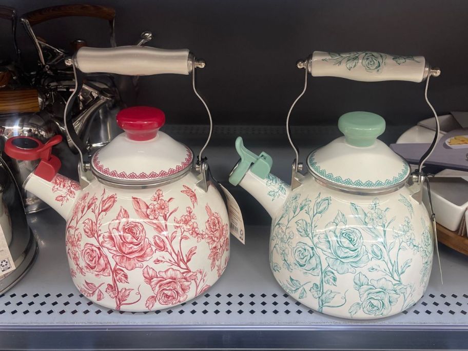 The Pioneer Woman Agatha 2-Quart Enamel on Steel Tea Kettles on shelf in store