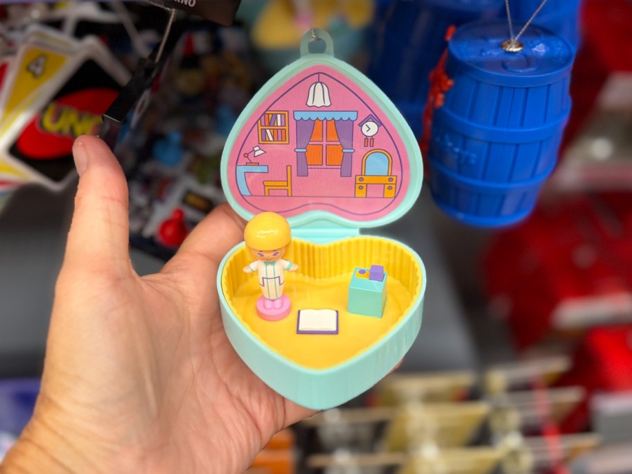 hand holdind polly pocket ornament 