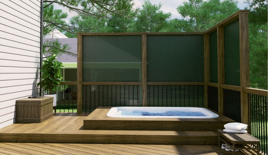 a lap pool shielded with a green privacy screen partition