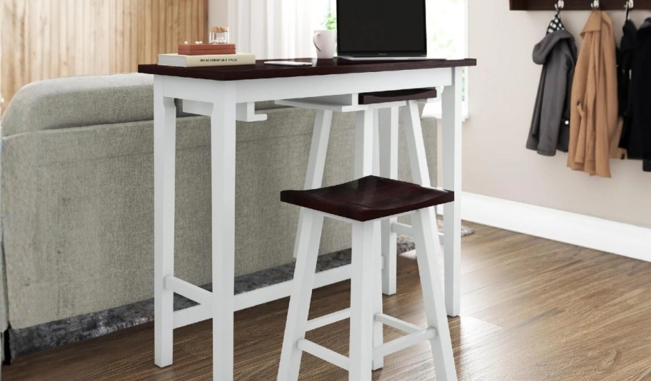 a 3 piece pub table and stool set