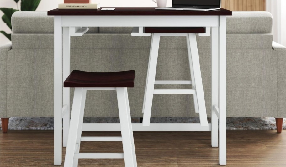 a 3 piece pub table and stool set