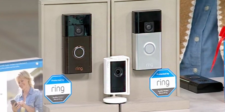 ring camera and two doorbells on table