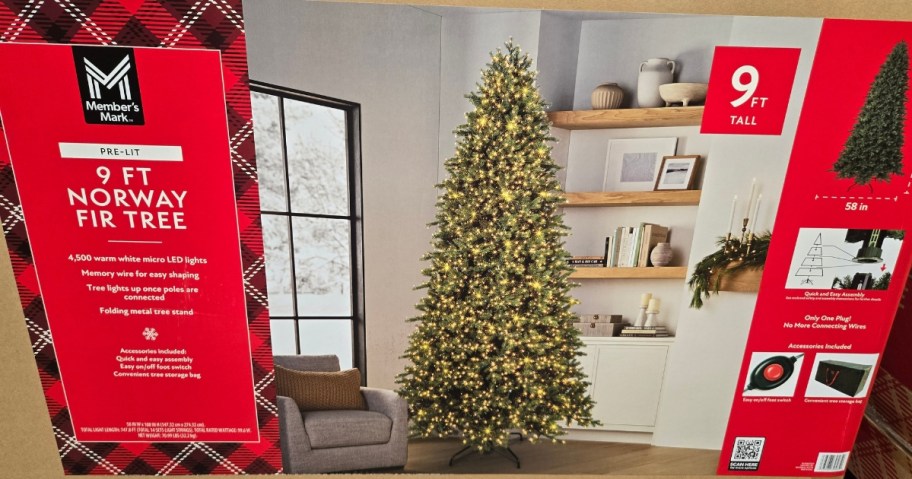 a pre-lit green Christmas tree in a box