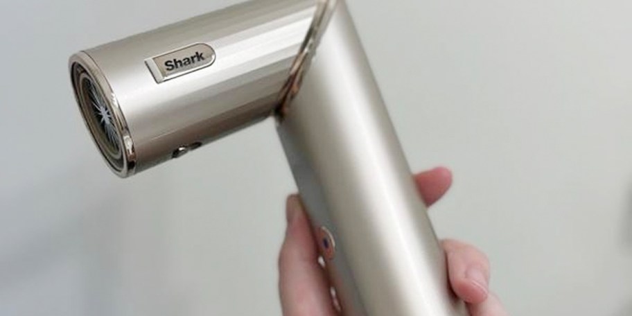 hand holding shark flexstyle hair dryer