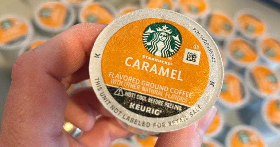 starbucks caramel k-cup in hand