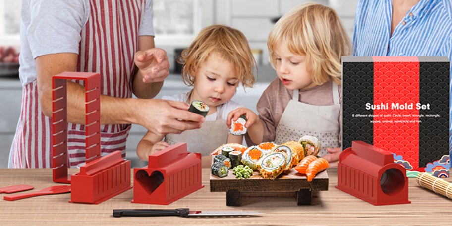 family making sushi with kit on table
