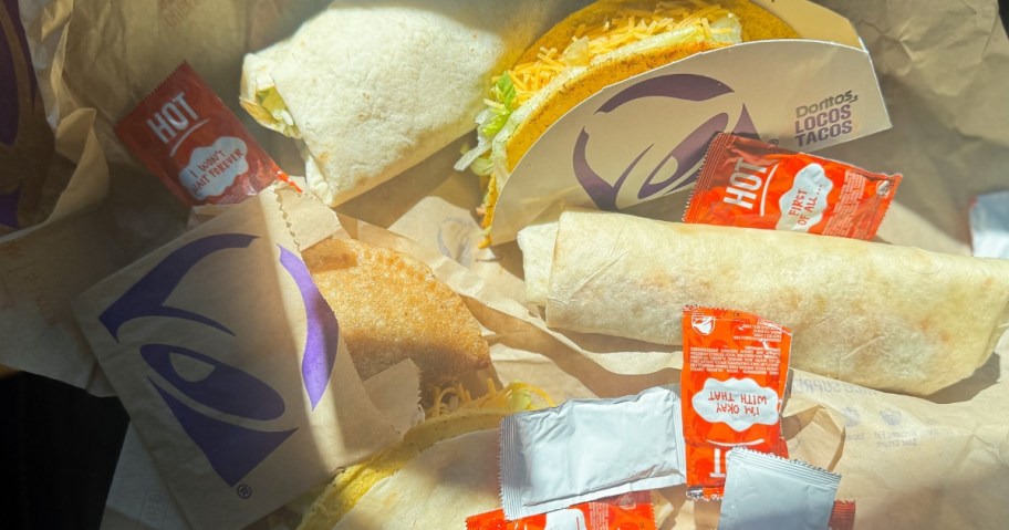 taco bell items surrounded by hot sauce packets