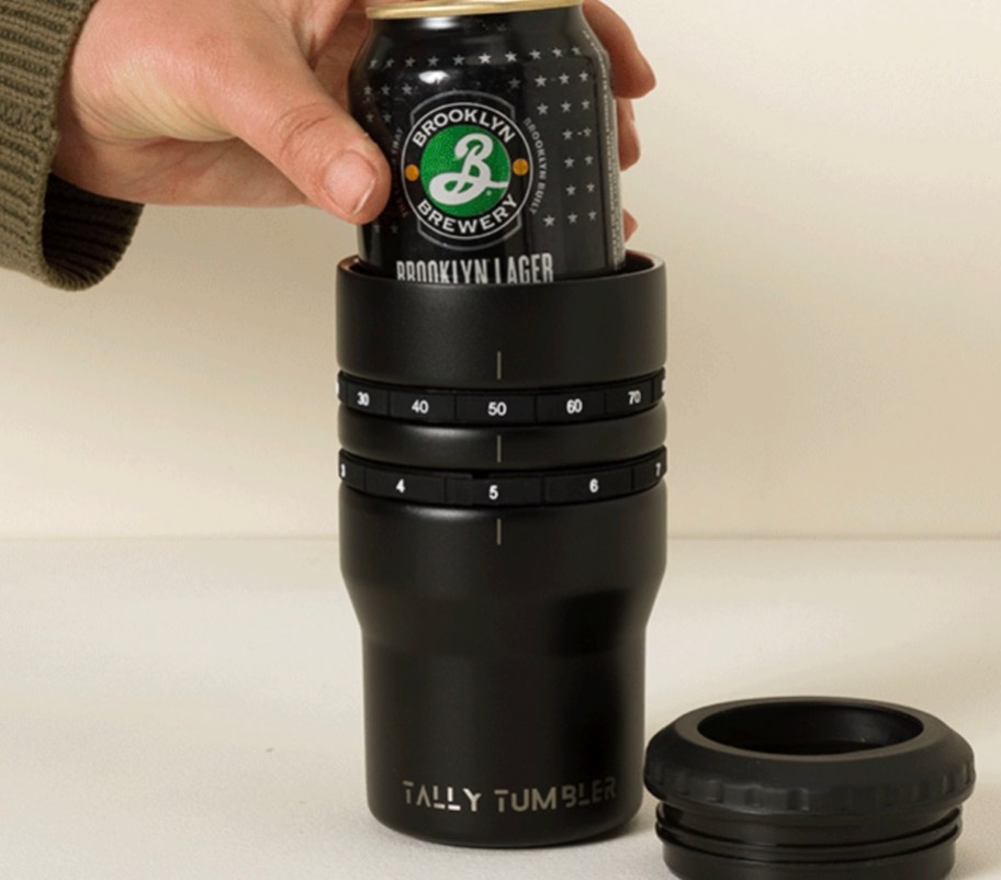 hand putting can of beer into tally tumbler