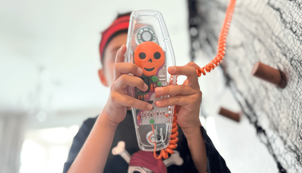 holding retro Halloween phone