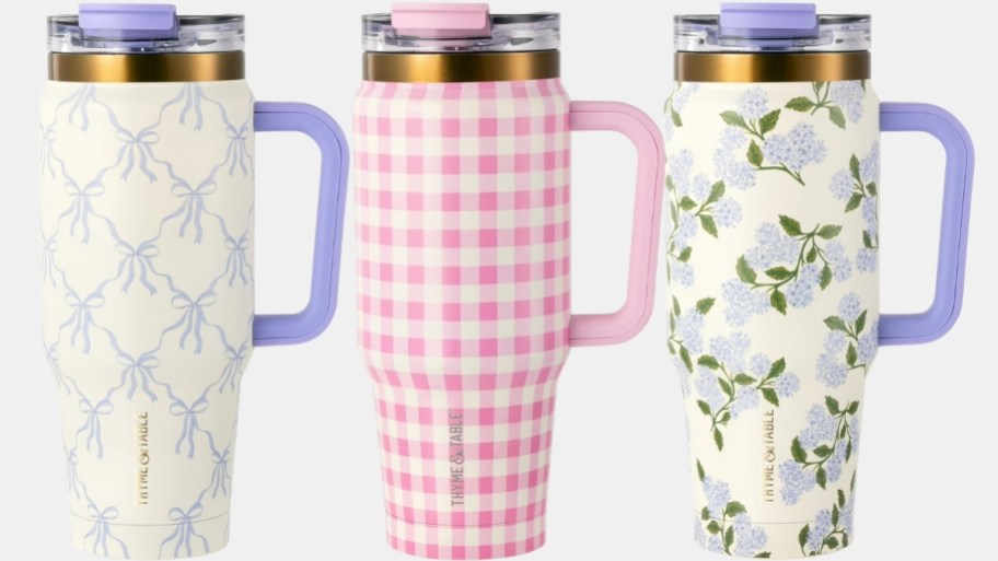 three 32oz straw tumblers in floral designs