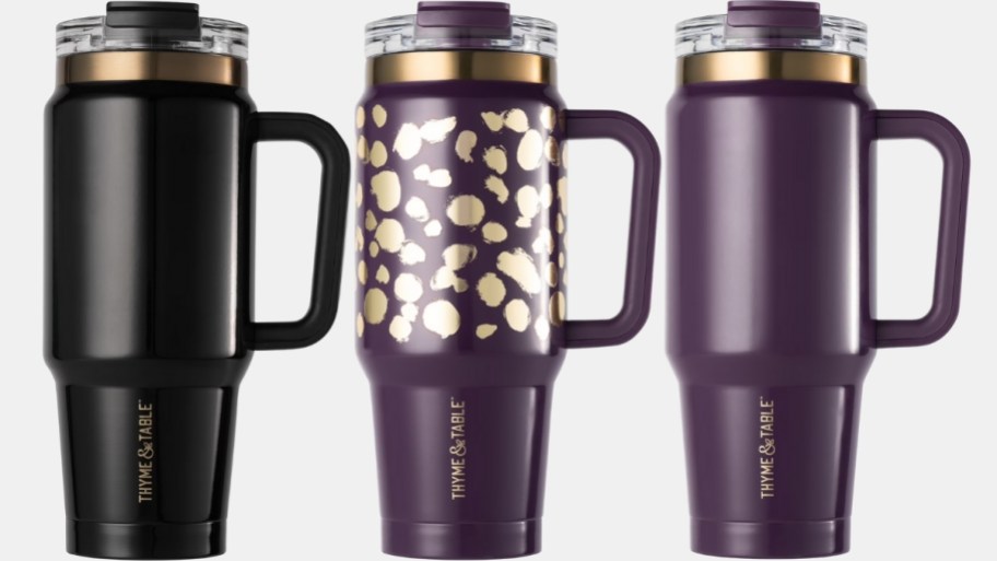 three 32oz tumblers in black, purple and purple and gold dots