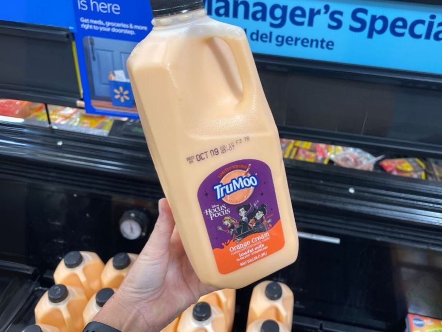 TruMoo Hocus Pocus Orange Cream Milk Half Gallon in hand in store