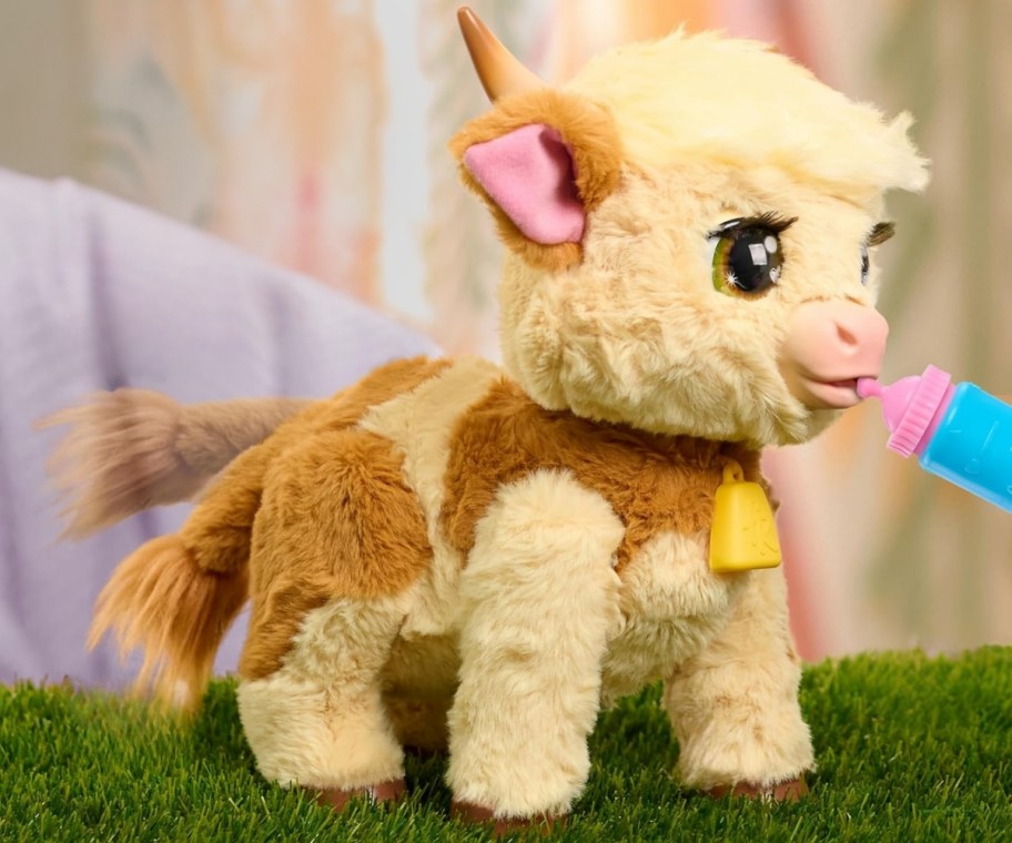 a small animatronic interactive cow toy