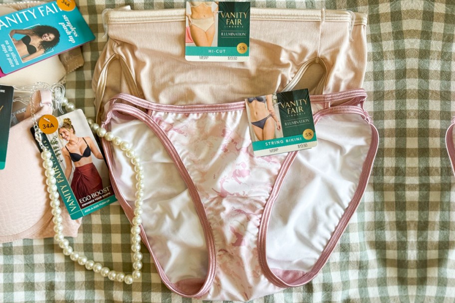 two underwear on hangers on green plaid background
