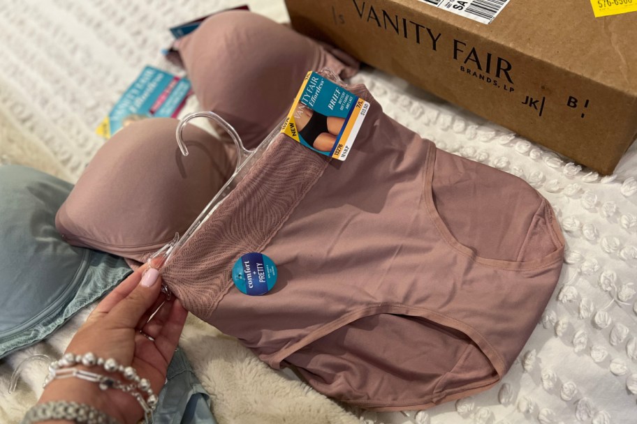 Hold the mauve briefs on the hanger