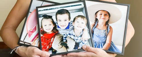 person holding three tilepix photos