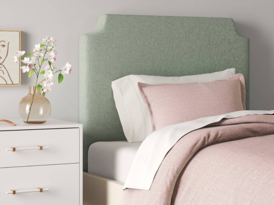 upholstered headboard mounted on a wall