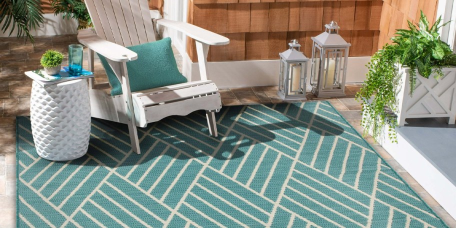 turquoise and white rugs with white chair